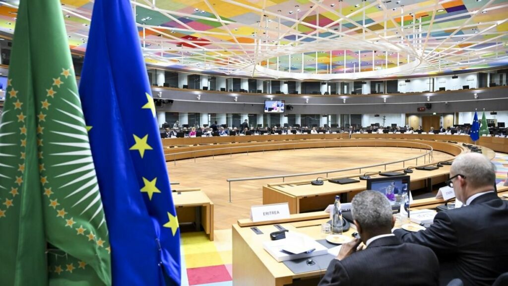 Plenary hall with flags of the African Union and the European Union in the background